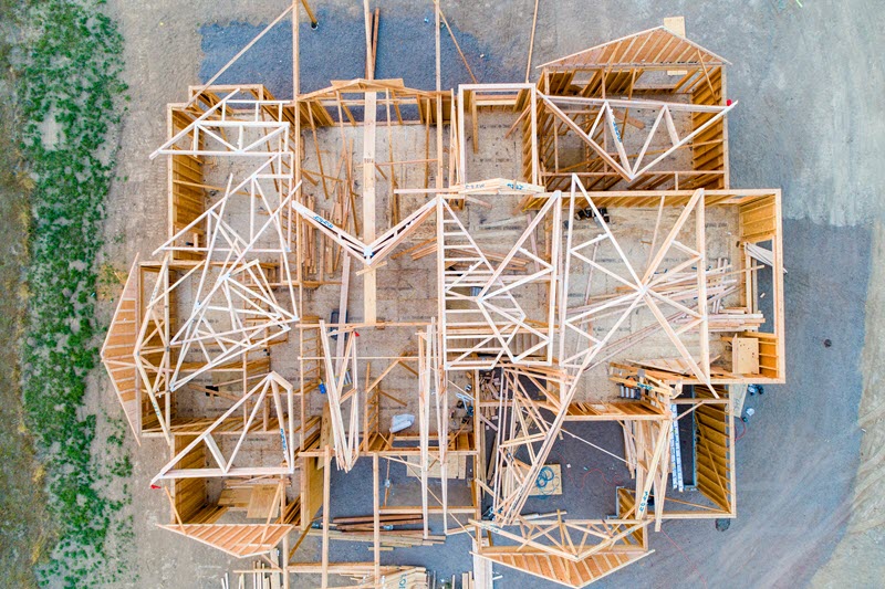 Photo of a house being built, taken from above.