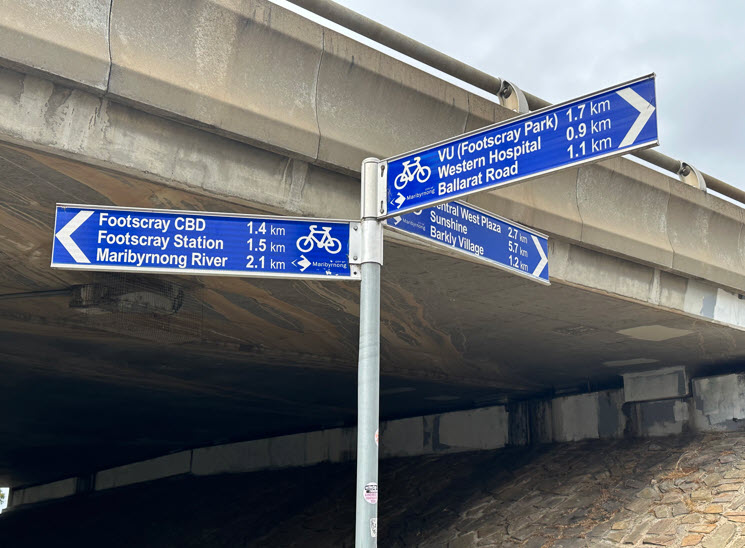 Signs showing distance to various locations.