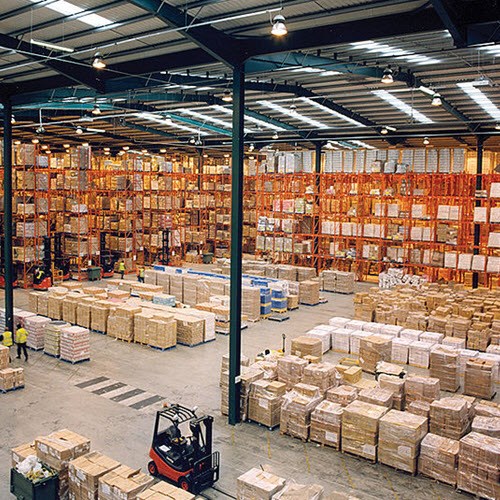 Image of a large warehouse filled with boxes and crates